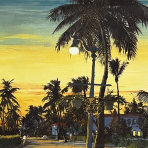 Tropical sunset with palm trees and streetlights.