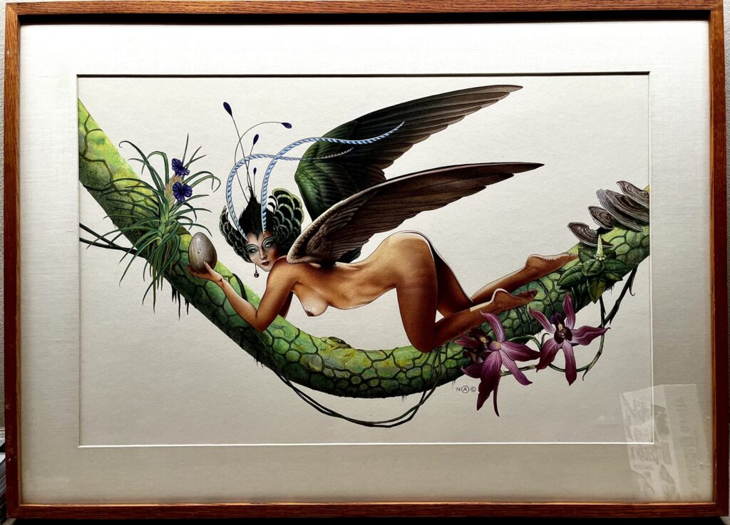 Fairy with wings on a floral branch.